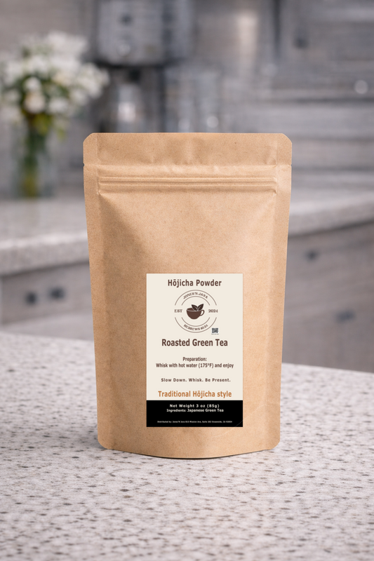 Compostable kraft pouch of hojicha roasted green tea powder with product label displayed on countertop