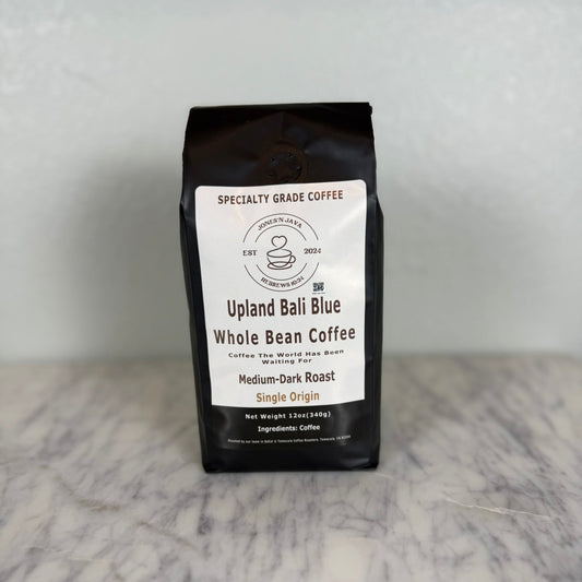 Upland Bali Blue whole bean coffee medium dark roast single origin coffee bag by Jones’N Java on marble surface